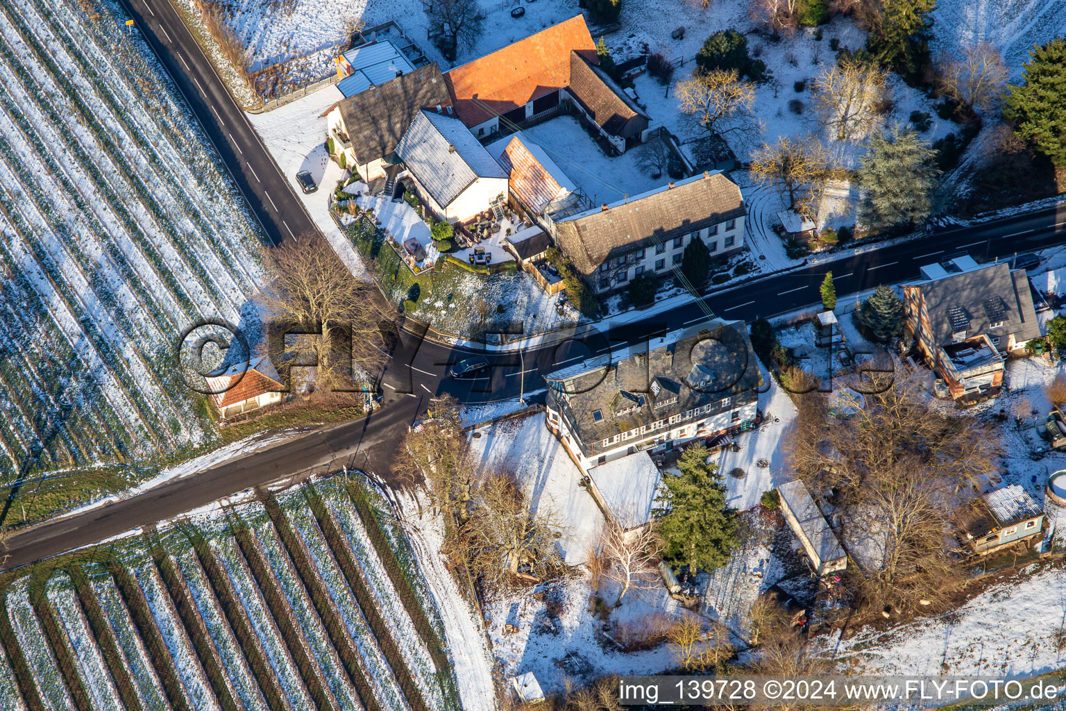 Aerial view of Landhotel Windhof in winter with snow in Schweighofen in the state Rhineland-Palatinate, Germany