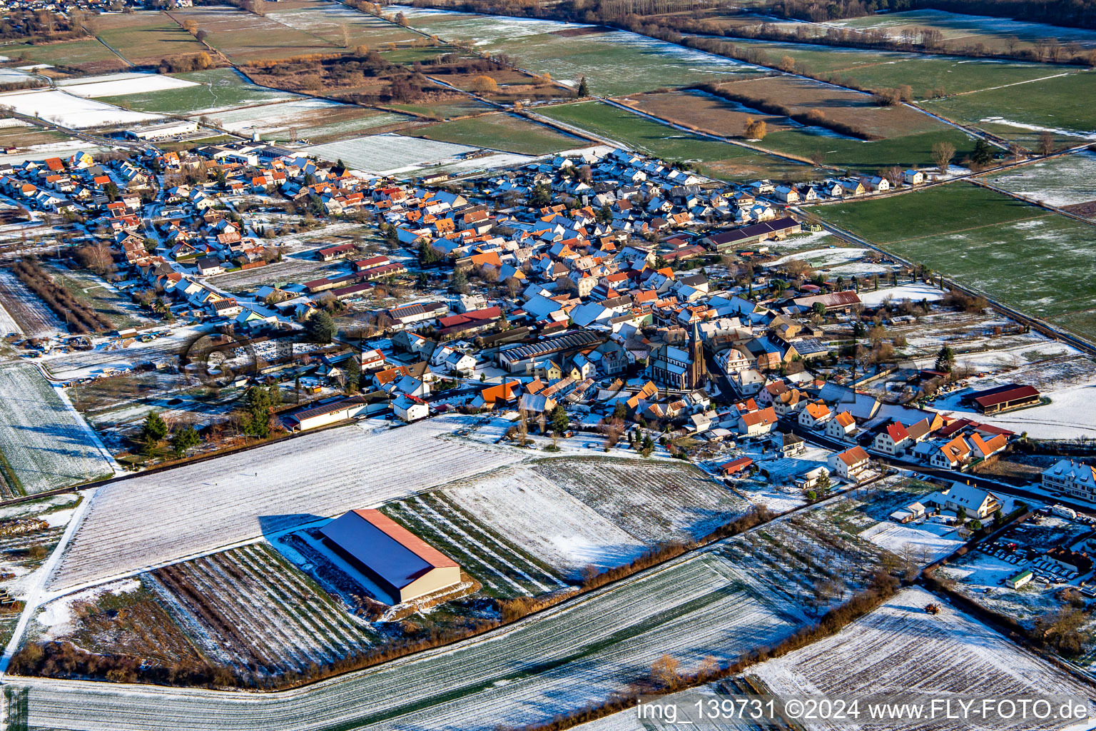 Aerial view of In winter with snow from the west in Schweighofen in the state Rhineland-Palatinate, Germany