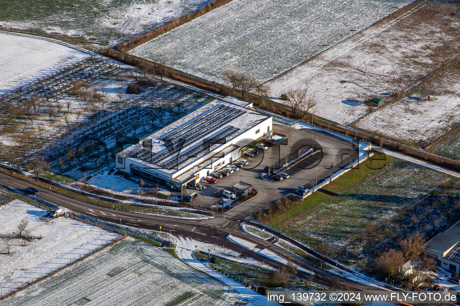 Aldi in winter with snow in Schweighofen in the state Rhineland-Palatinate, Germany