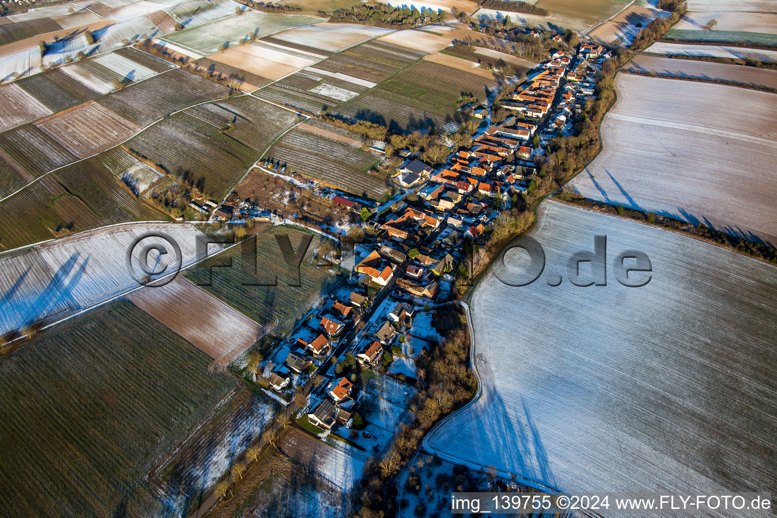 Aerial view of In winter when there is snow from the west in Vollmersweiler in the state Rhineland-Palatinate, Germany