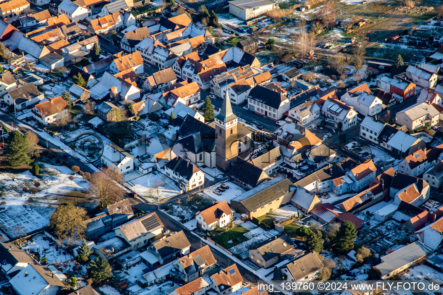 Parish Church of St. Leo in winter with snow in the district Schaidt in Wörth am Rhein in the state Rhineland-Palatinate, Germany