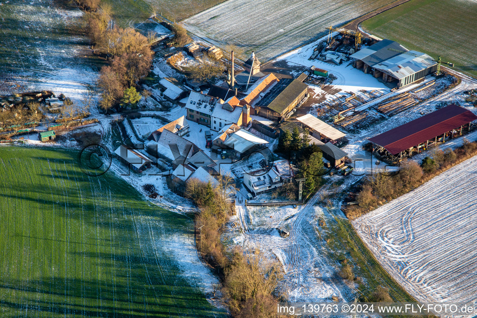 Aerial view of Holzwerk ORTH in the Schaidter Mühle in winter with snow in the district Schaidt in Wörth am Rhein in the state Rhineland-Palatinate, Germany