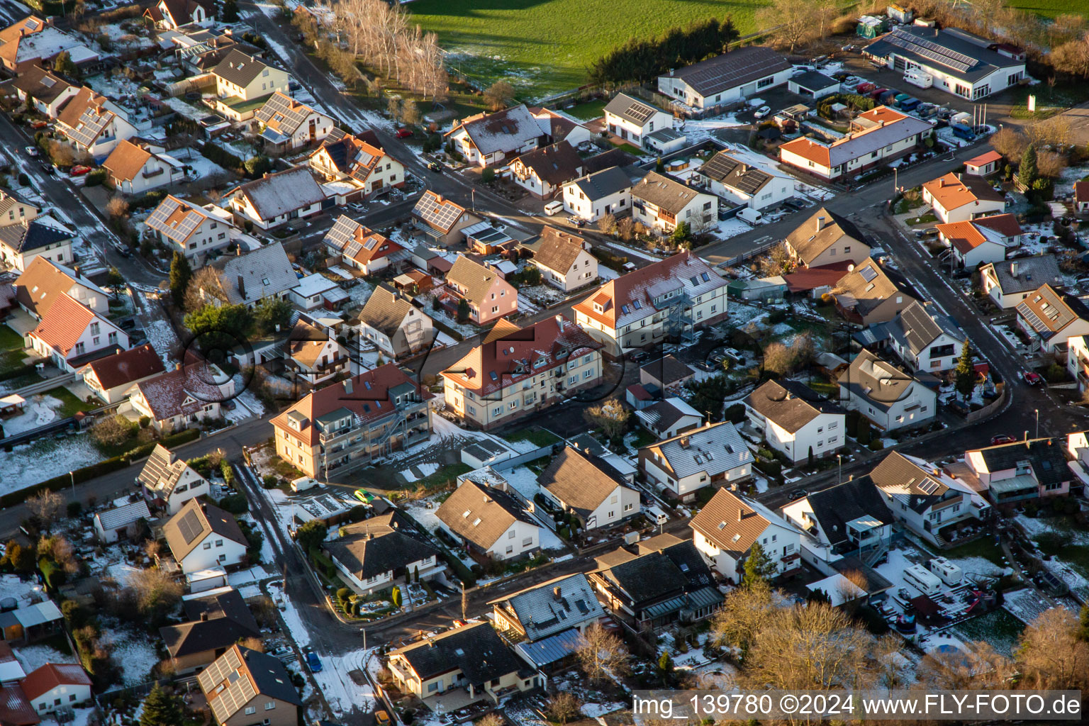 Aerial view of Steinweilerer Straße in winter with snow in Winden in the state Rhineland-Palatinate, Germany