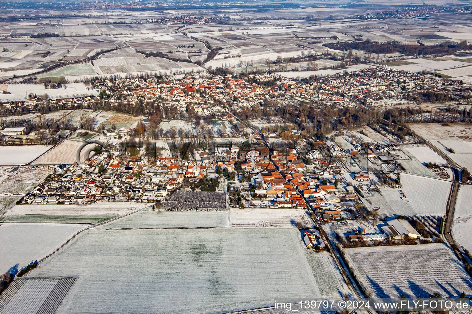Aerial view of From the south in the snow in winter in the district Mühlhofen in Billigheim-Ingenheim in the state Rhineland-Palatinate, Germany
