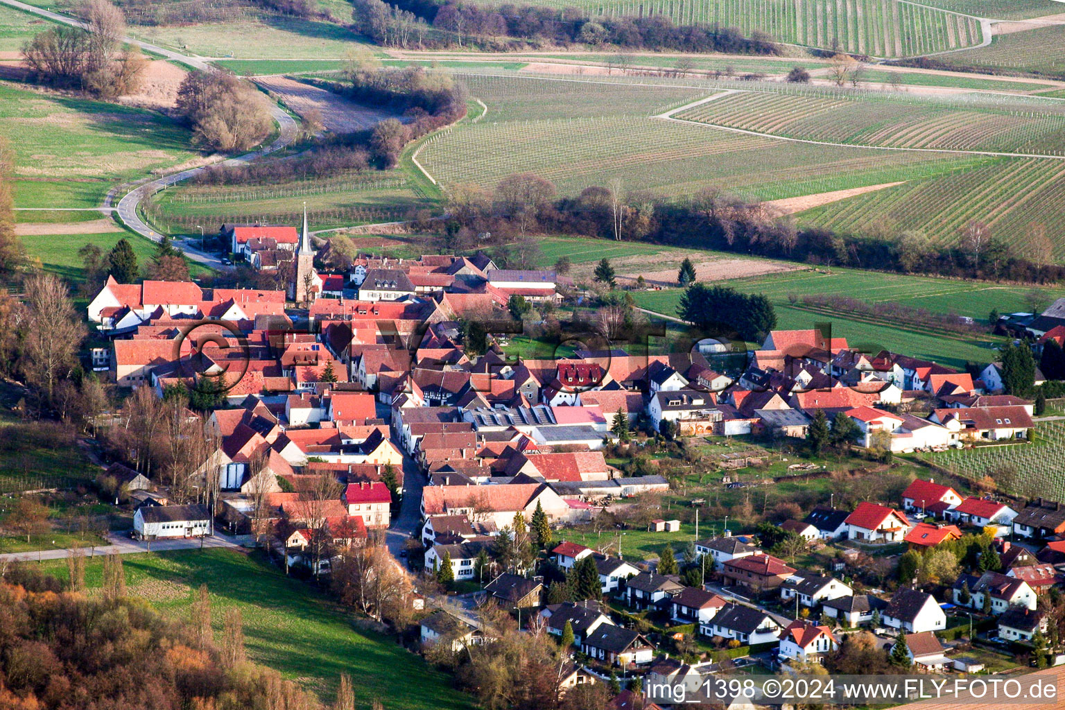 Village - view on the edge of agricultural fields and farmland in the district Heuchelheim in Heuchelheim-Klingen in the state Rhineland-Palatinate