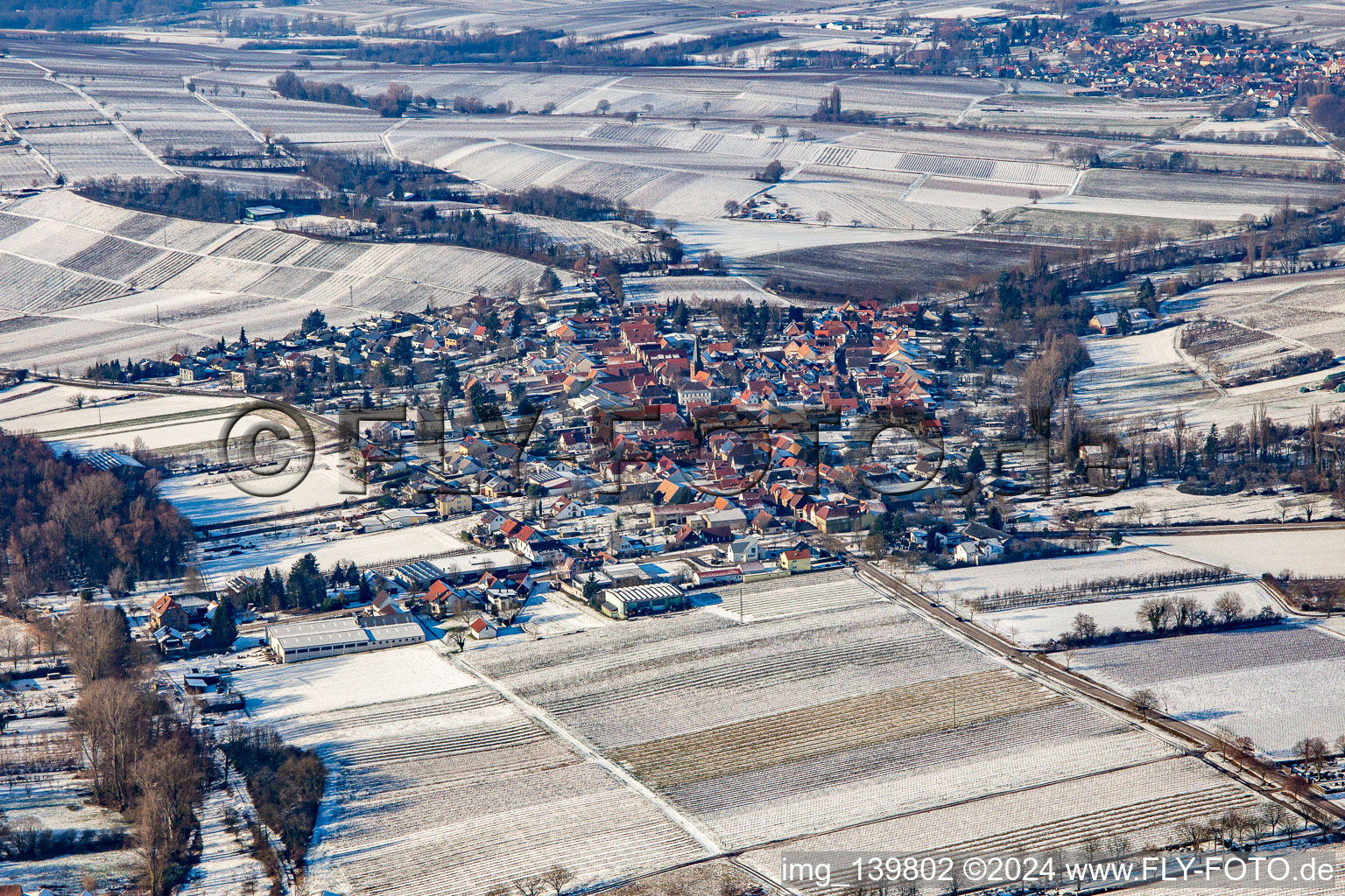 From the east in winter in the snow in the district Heuchelheim in Heuchelheim-Klingen in the state Rhineland-Palatinate, Germany