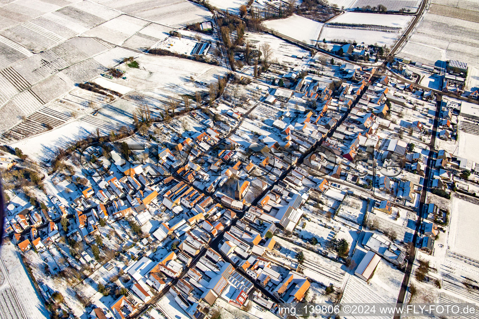 From the west in winter in the snow in the district Heuchelheim in Heuchelheim-Klingen in the state Rhineland-Palatinate, Germany