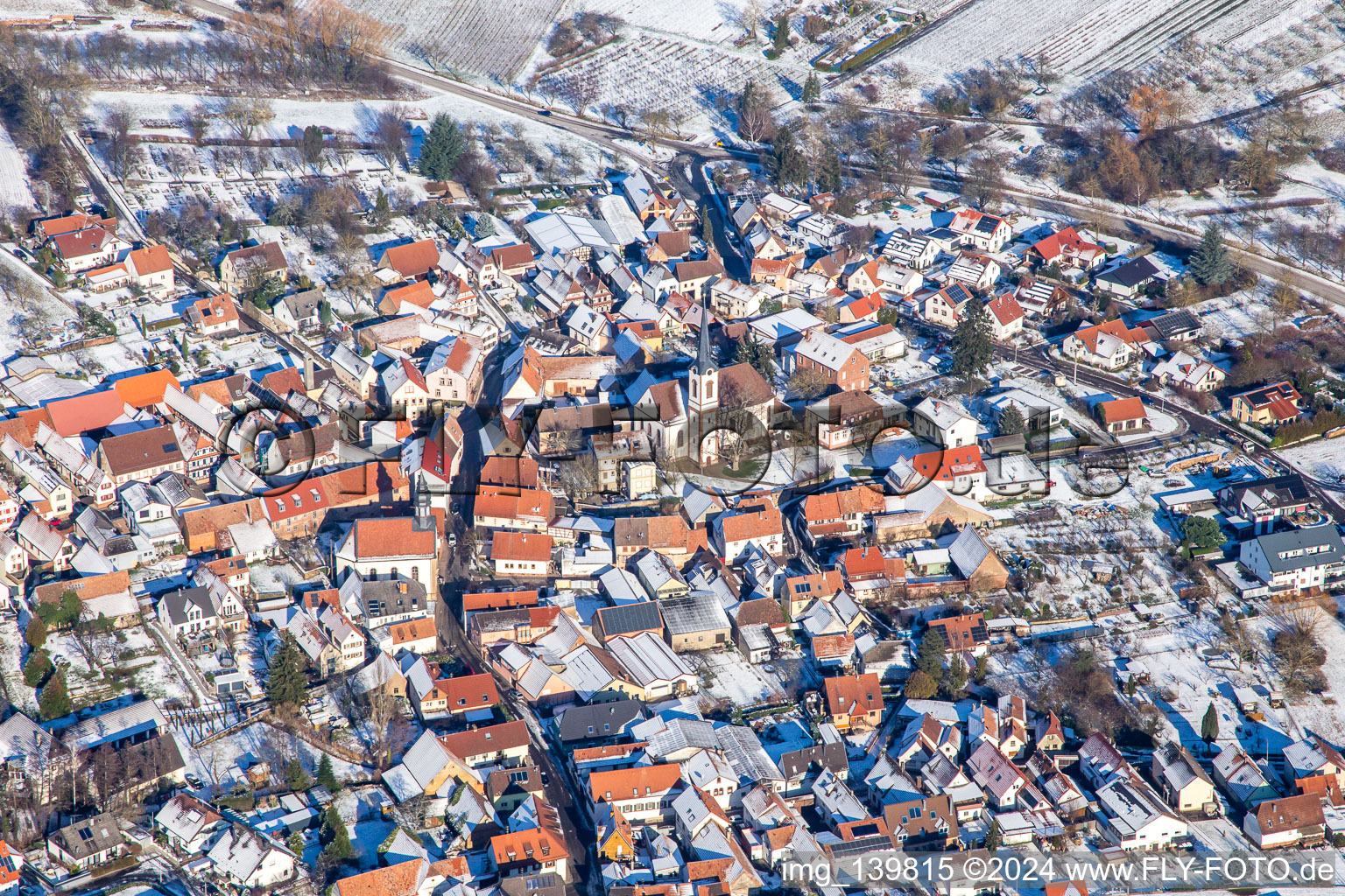 Laurentiuskirche from the south in winter in the snow in Göcklingen in the state Rhineland-Palatinate, Germany