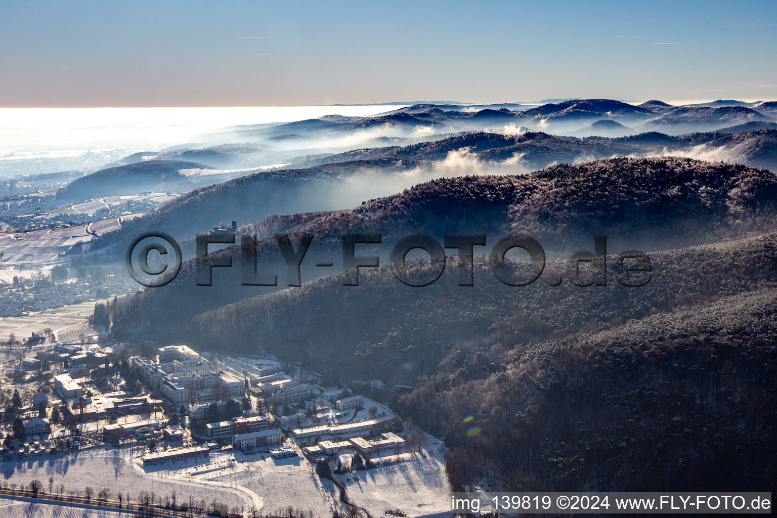 Aerial view of Pfalzklinik Landeck from the northwest in winter in the snow in Klingenmünster in the state Rhineland-Palatinate, Germany