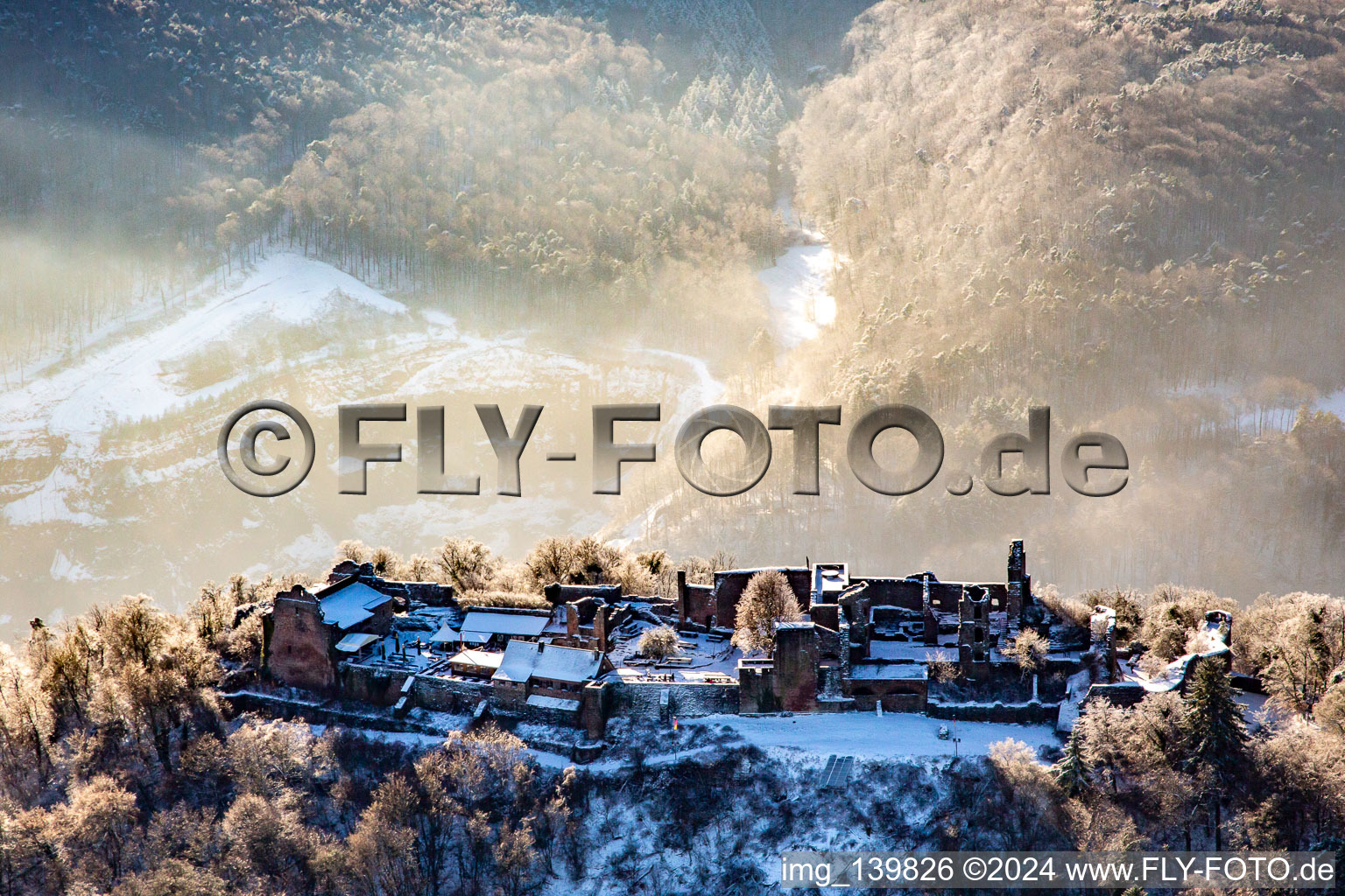 Oblique view of Runie Madenburg in winter with snow in Eschbach in the state Rhineland-Palatinate, Germany