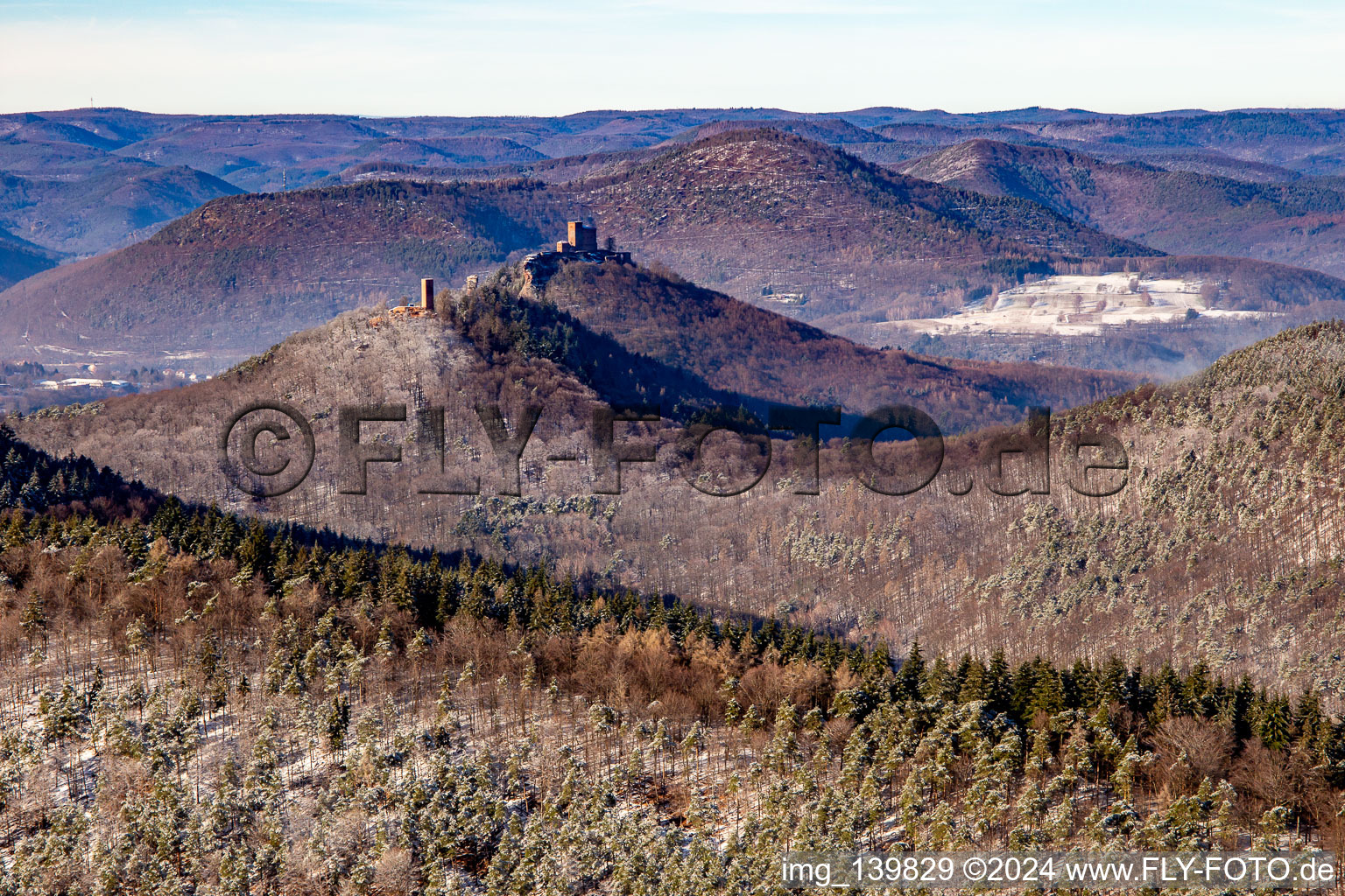 Trifels Castle, Anebos and Scharfenberg castle ruins from the southeast in winter with snow in Leinsweiler in the state Rhineland-Palatinate, Germany