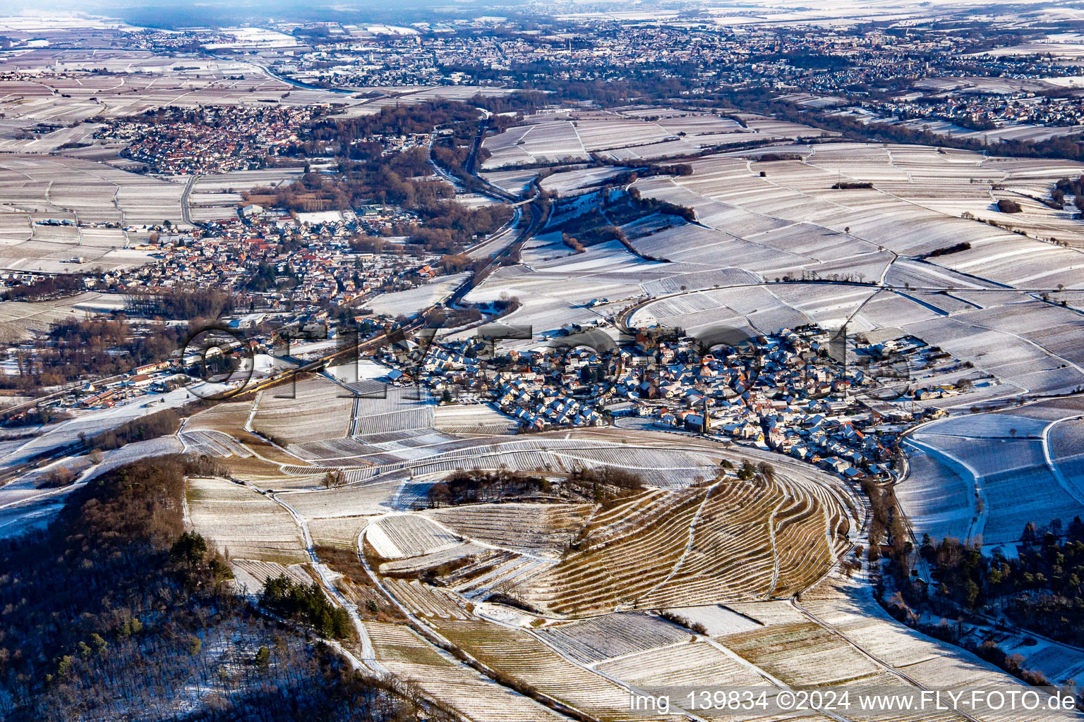 Keschdebusch vineyard from the west in winter with snow in Birkweiler in the state Rhineland-Palatinate, Germany