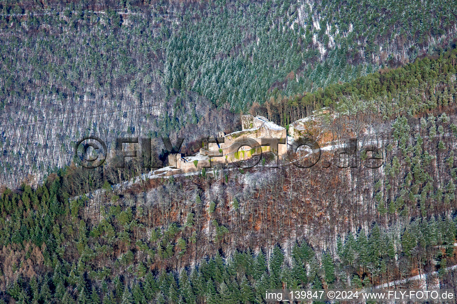 Aerial view of Neuscharfeneck castle ruins from the south in winter with snow in Flemlingen in the state Rhineland-Palatinate, Germany