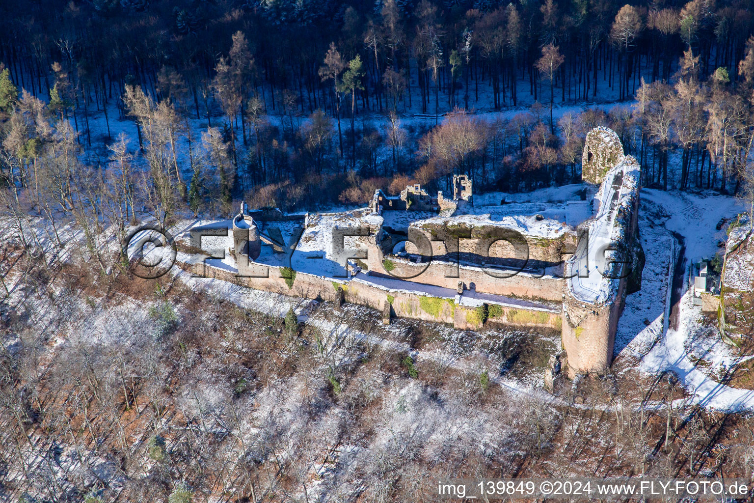 Oblique view of Neuscharfeneck castle ruins from the south in winter with snow in Flemlingen in the state Rhineland-Palatinate, Germany