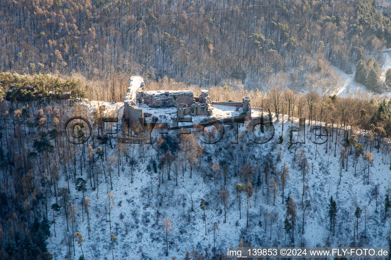 Aerial view of Neuscharfeneck castle ruins from the north in winter with snow in Flemlingen in the state Rhineland-Palatinate, Germany