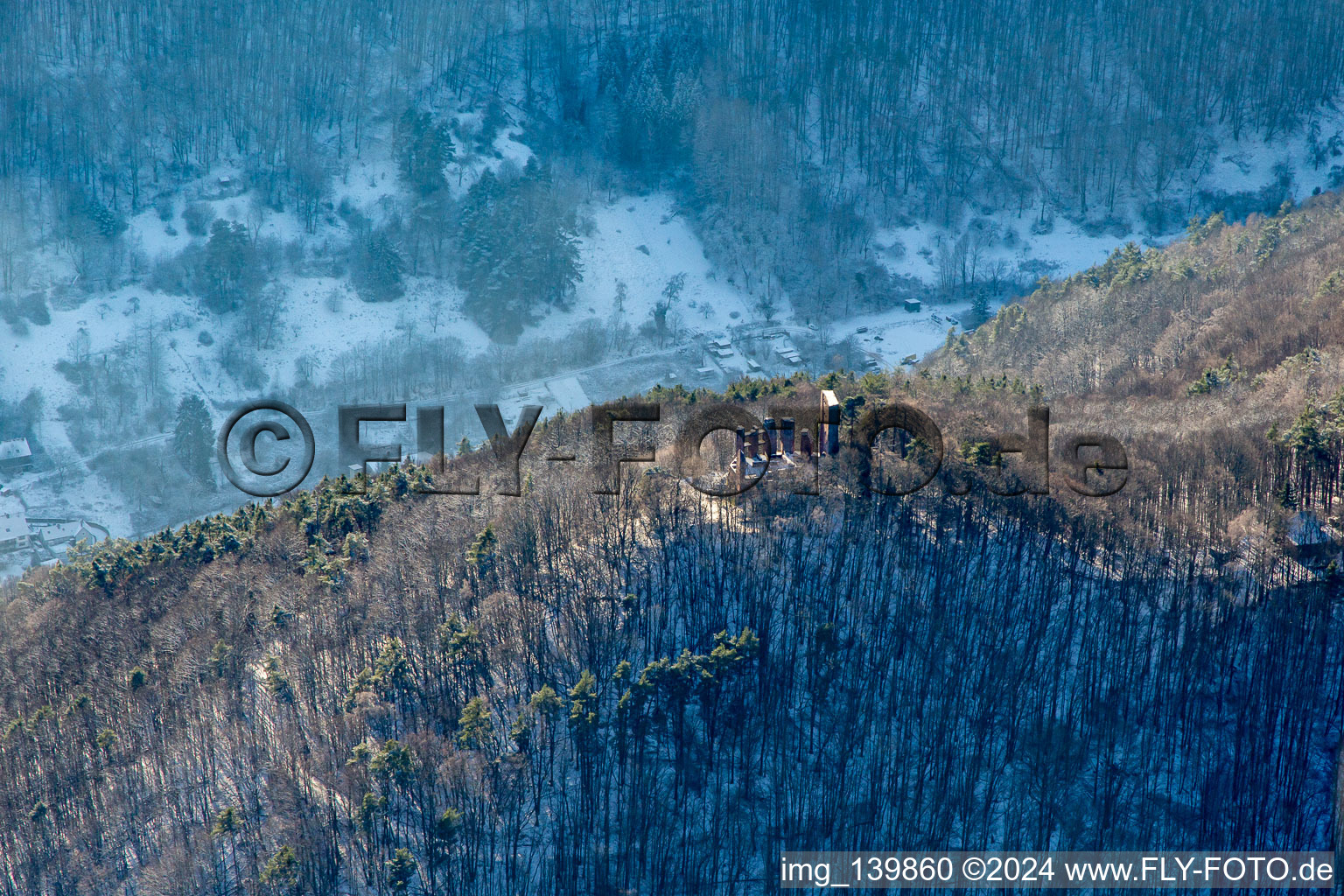 Ramburg castle ruins in winter with snow in Ramberg in the state Rhineland-Palatinate, Germany