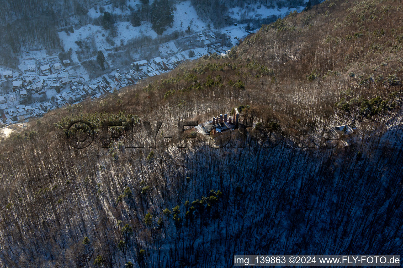 Aerial photograpy of Ramburg castle ruins in winter with snow in Ramberg in the state Rhineland-Palatinate, Germany