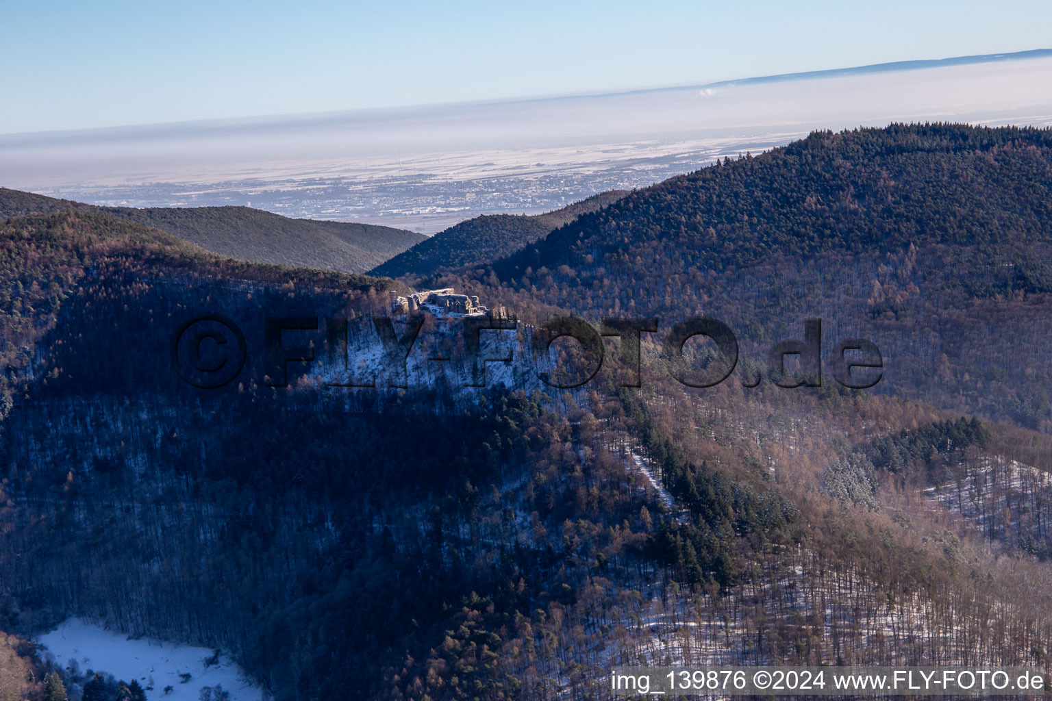 Neuscharfeneck castle ruins from the northwest in winter with snow in Ramberg in the state Rhineland-Palatinate, Germany