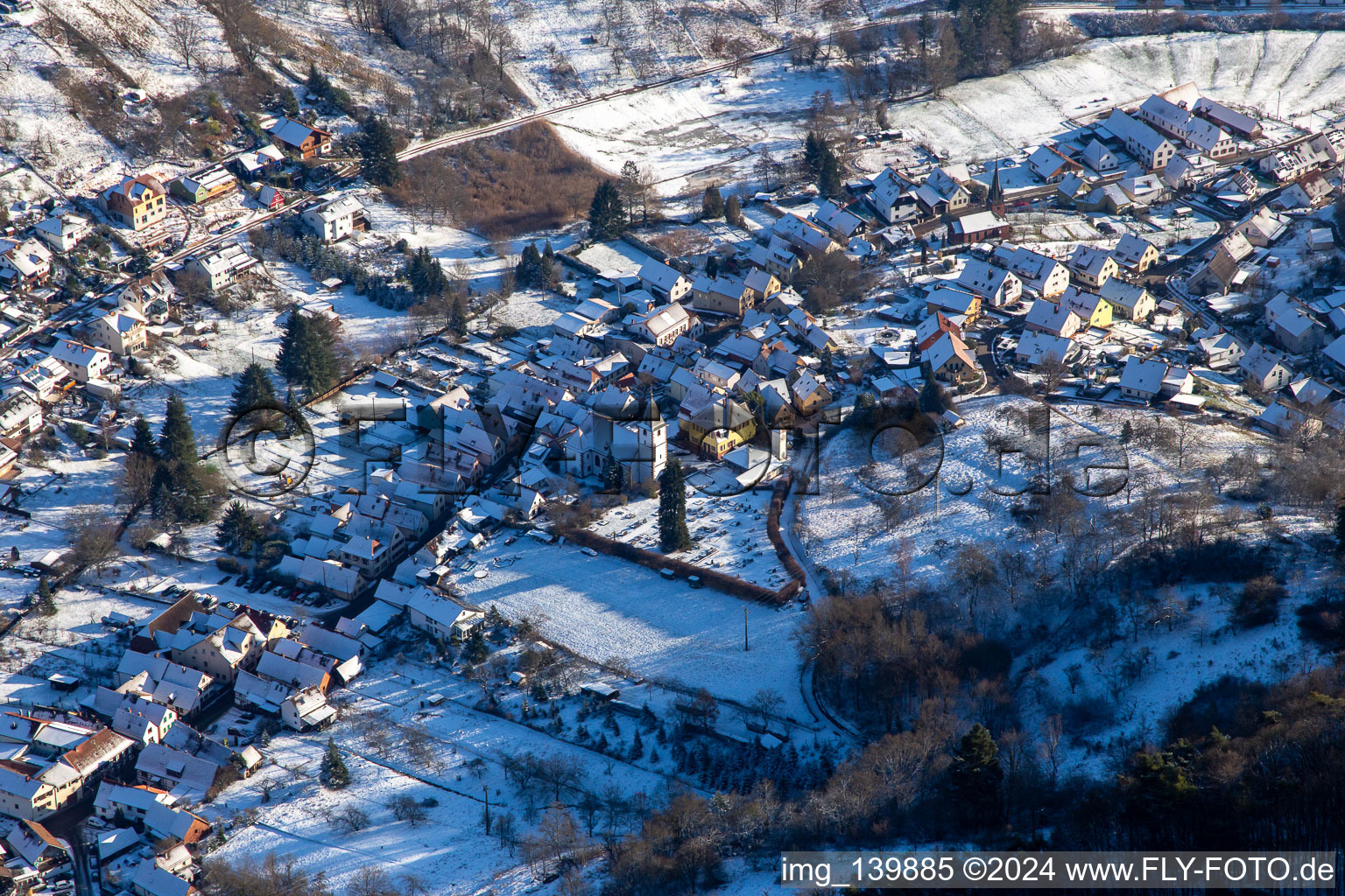 Church in winter with snow in Dernbach in the state Rhineland-Palatinate, Germany