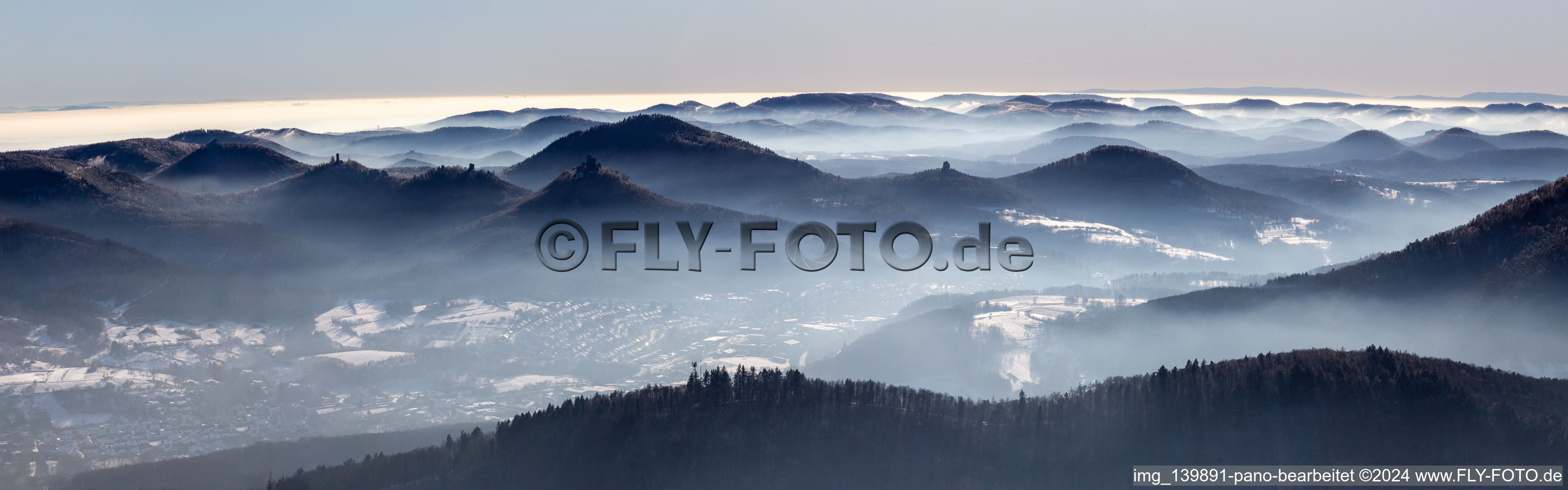 Panorama of the Palatinate Forest with Trifels Castle, Anebos and Scharfenberg castle ruins above the Queichtal from the north in winter with snow in Eußerthal in the state Rhineland-Palatinate, Germany