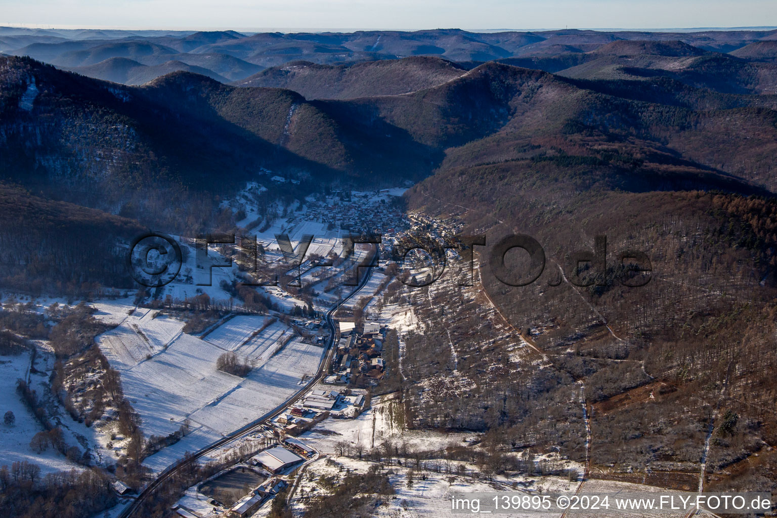 From the east in winter with snow in the district Gräfenhausen in Annweiler am Trifels in the state Rhineland-Palatinate, Germany