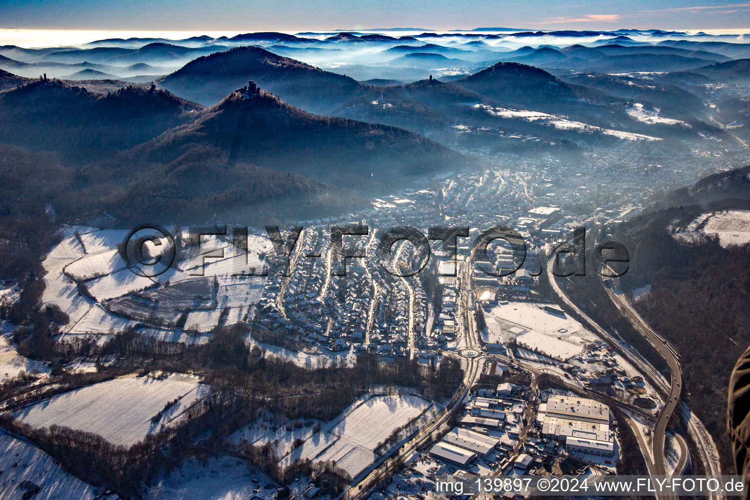 Queichtal with Rehbergturm, Trifels Castle, Anebos and Scharfenberg castle ruins from the east in winter with snow in Annweiler am Trifels in the state Rhineland-Palatinate, Germany