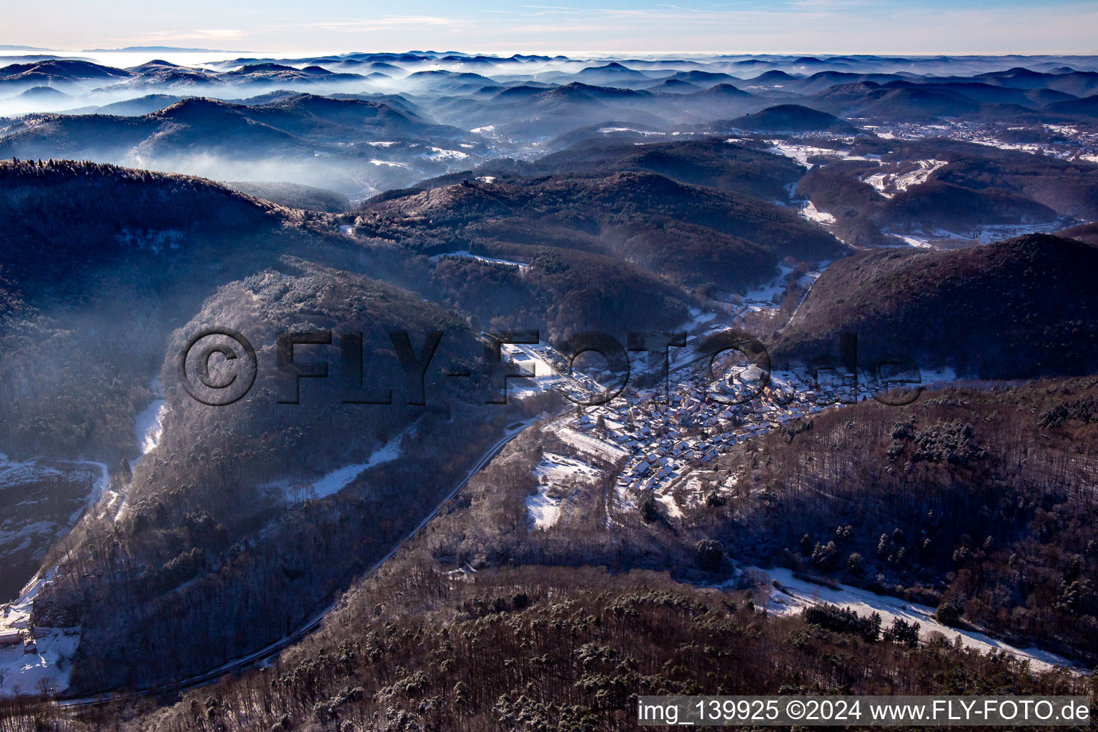 Aerial photograpy of From the northeast in winter when there is snow in Waldhambach in the state Rhineland-Palatinate, Germany