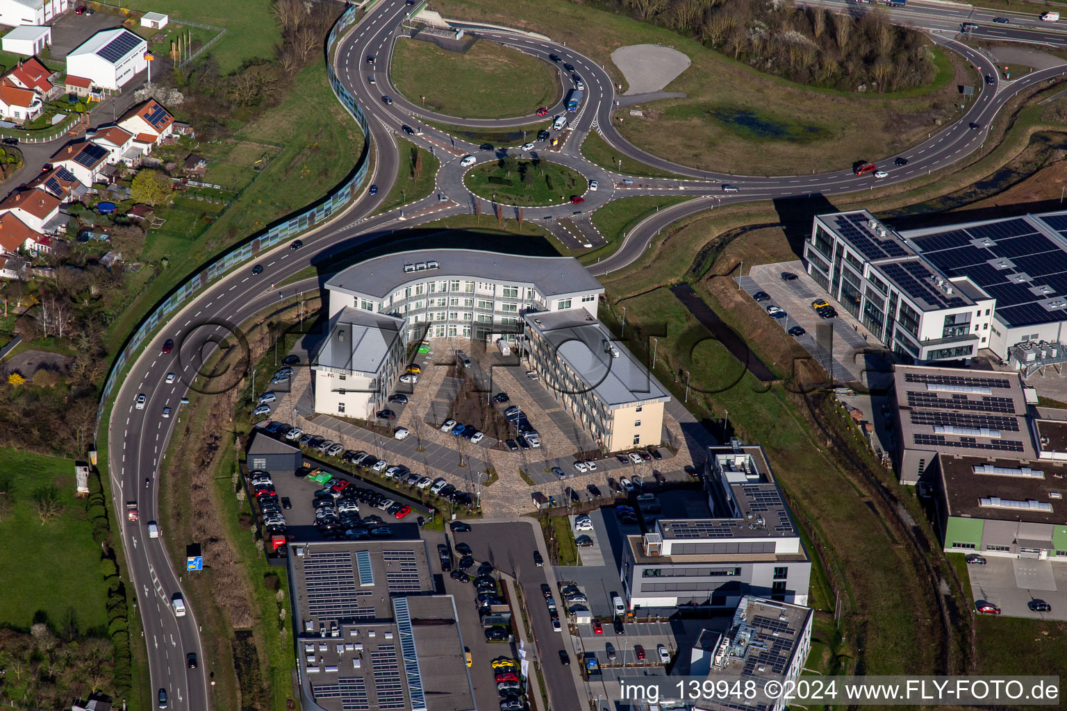 Office building at the roundabout to the A65 LD Mitte motorway exit in the district Queichheim in Landau in der Pfalz in the state Rhineland-Palatinate, Germany