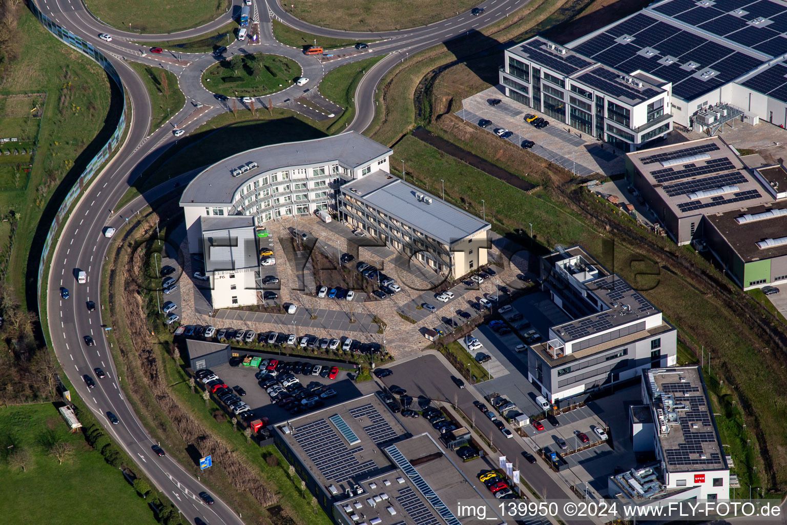 Aerial view of Office building at the roundabout to the A65 LD Mitte motorway exit in the district Queichheim in Landau in der Pfalz in the state Rhineland-Palatinate, Germany