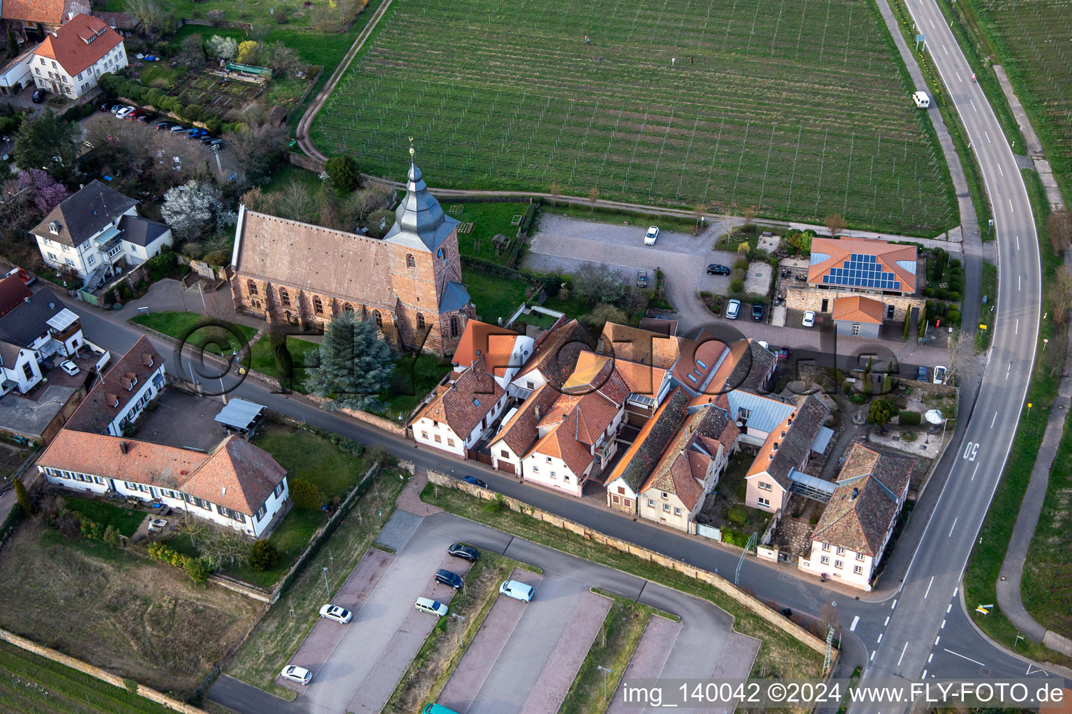 Aerial view of The wine house - Vinothek Meßmer, Ritterhof zur Rose at the Catholic parish church of Maria Heimsuchung in Burrweiler in the state Rhineland-Palatinate, Germany