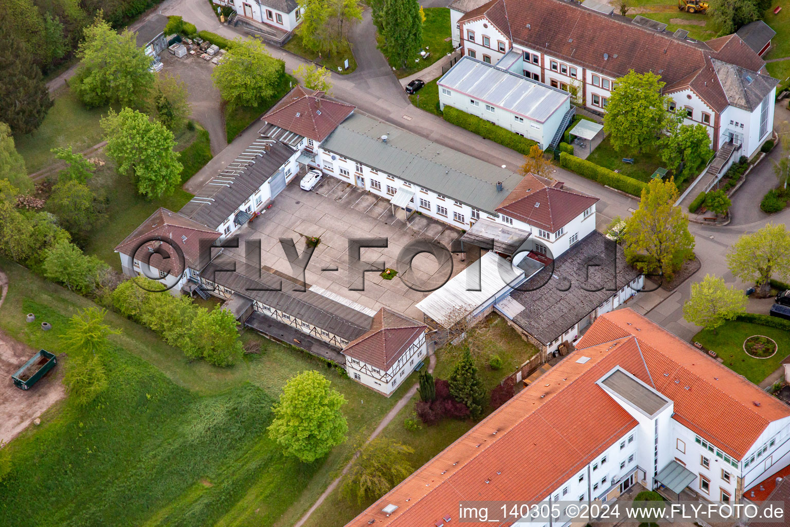 Palatinate Clinic for Psychiatry and Neurology "Landeck" with Department of General Psychiatry and Addiction Disorders - Clinic for Psychiatry, Psychosomatics and Psychotherapy, Clinic for Forensic Psychiatry, Clinic for Gerontopsychiatry, Psychosomatics and Psychotherapy, Clinic for Neurology, Clinic for Psychiatry, Psychosomatics and Psychotherapy, Clinic for Child and Adolescent Psychiatry, Psychosomatics and Psychotherapy as well as Institute Outpatient Clinic, Psychiatric Institute Outpatient Clinics - Clinic for Psychiatry, Psychosomatics and Psychotherapy in Klingenmünster in the state Rhineland-Palatinate, Germany from above