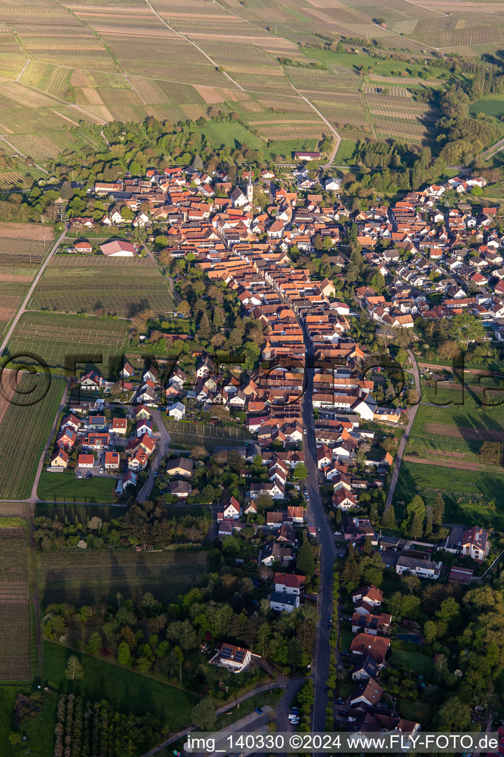 Main street from the west in the evening in Göcklingen in the state Rhineland-Palatinate, Germany