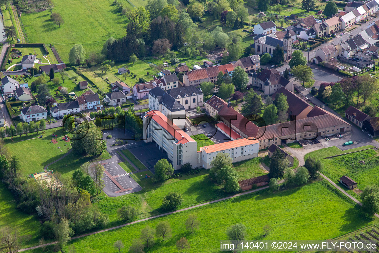 Aerial view of Clos du chateau and École élémentaire publique in Neufgrange in the state Moselle, France