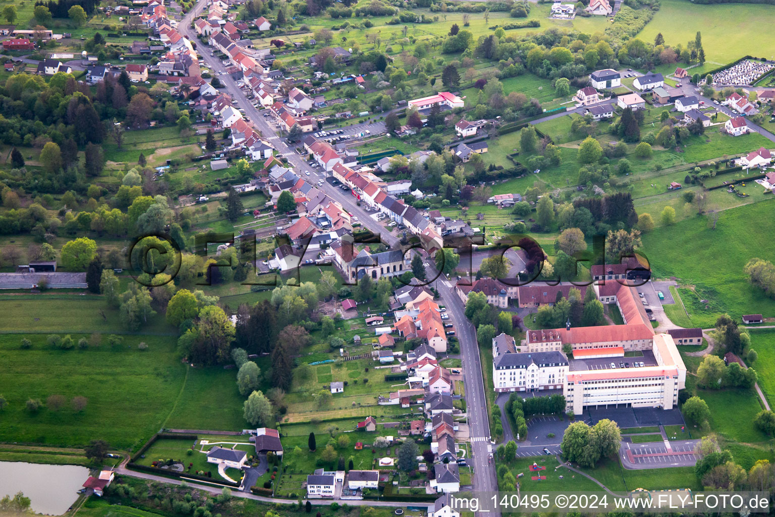 Aerial view of Rue Saint-Michel, Clos du chateau and École élémentaire publique in Neufgrange in the state Moselle, France