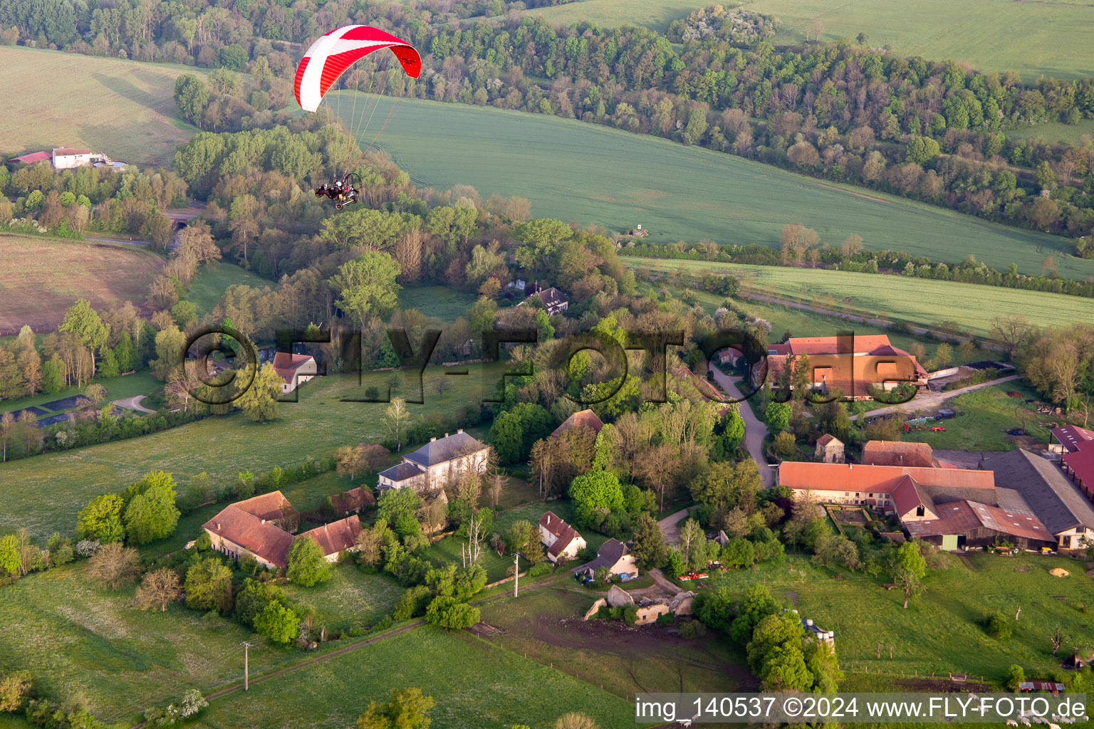 Paramotor in the morning over Chapelle Sainte-Barbe in Kalhausen in the state Moselle, France