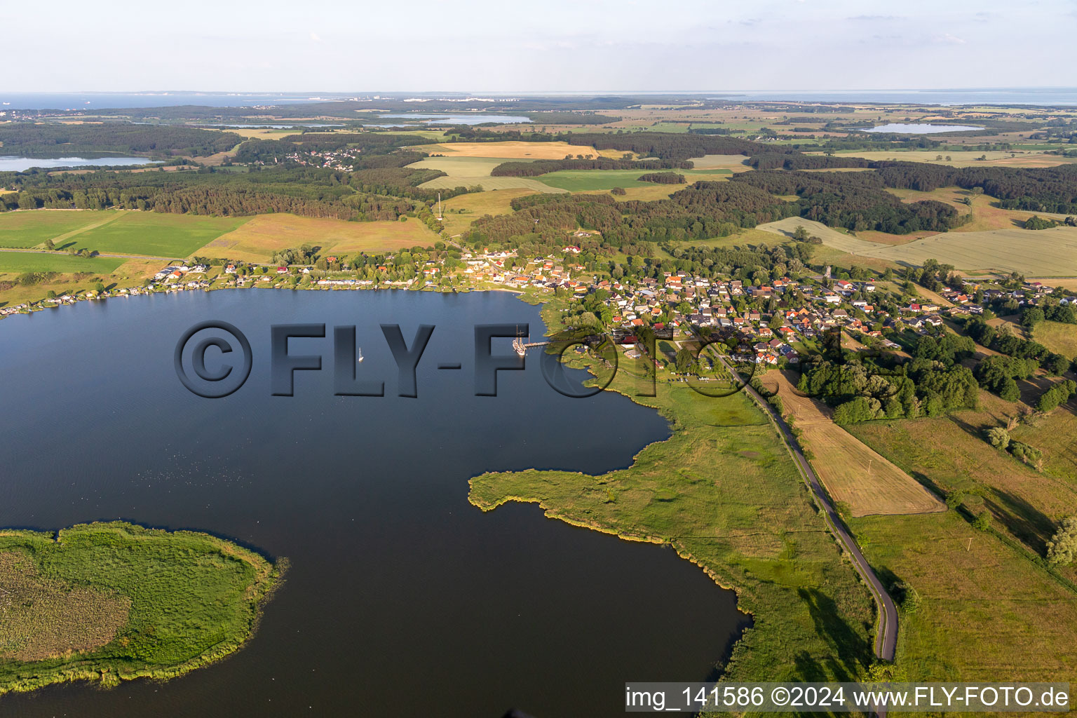 Village on the shore of Lake Balmer with Böhmke Island in Benz in the state Mecklenburg-Western Pomerania, Germany