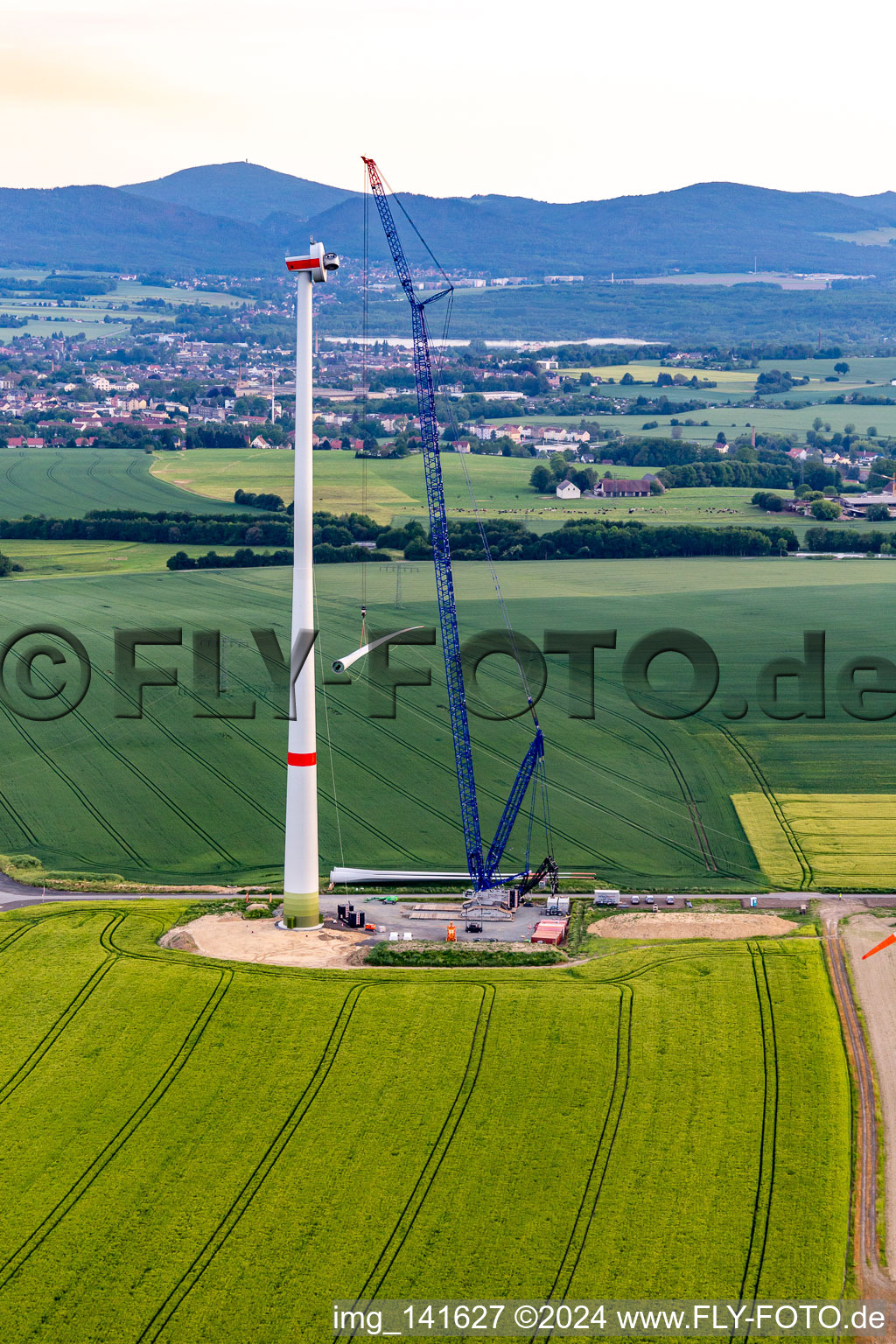 Oblique view of Construction site of a wind turbine at the Oberseifersdorf wind farm of Alterric Deutschland GmbH and Energiequelle GmbH in the district Eckartsberg in Mittelherwigsdorf in the state Saxony, Germany