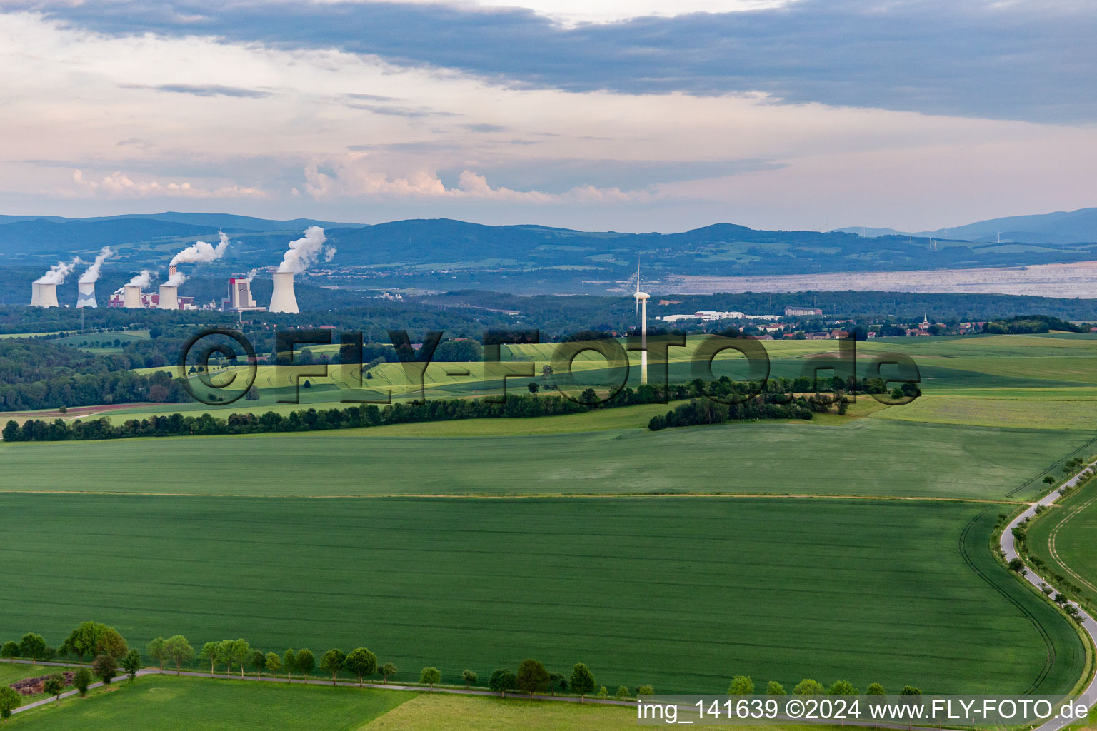 Wind turbine in front of the Polish lignite mine and power plant Turów in the district Schlegel in Zittau in the state Saxony, Germany