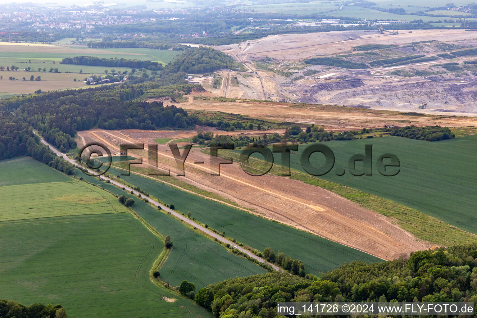 Aerial view of Demolition edge of the brown coal opencast mine "PGE Górnictwo i Energetyka Konwencjonalna Oddział Kopalnia Węgla Brunatnego Turów in Białopole in the state Lower Silesia, Poland