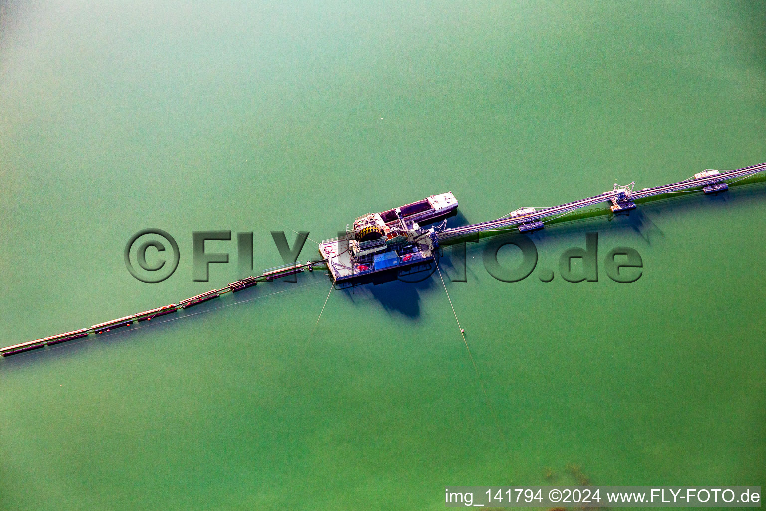 Floating dredger on the Giesen lake in the district Liedolsheim in Dettenheim in the state Baden-Wuerttemberg, Germany