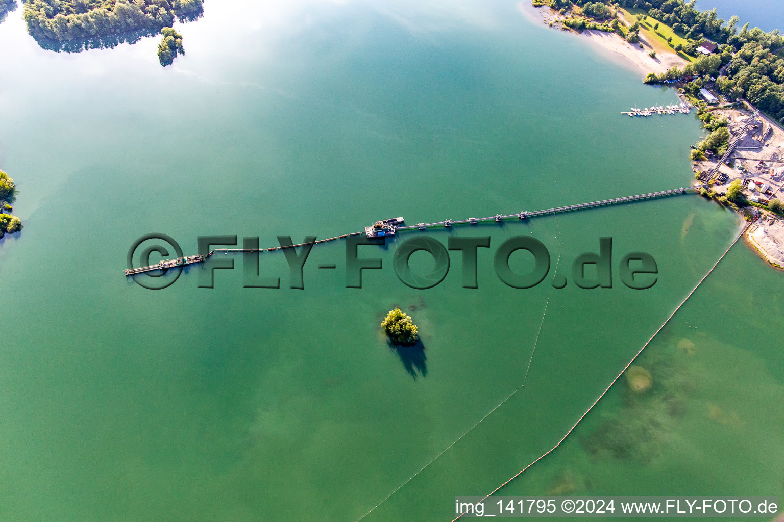 Floating dredger at the Giesen lake in the district Liedolsheim in Dettenheim in the state Baden-Wuerttemberg, Germany