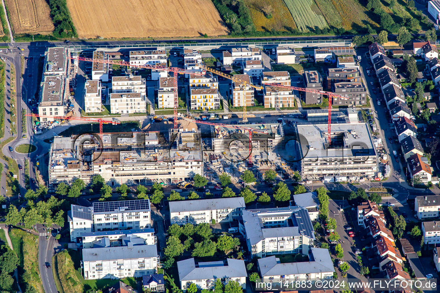 Multi-family house construction site "New City Centre" from the west in the district Mörsch in Rheinstetten in the state Baden-Wuerttemberg, Germany