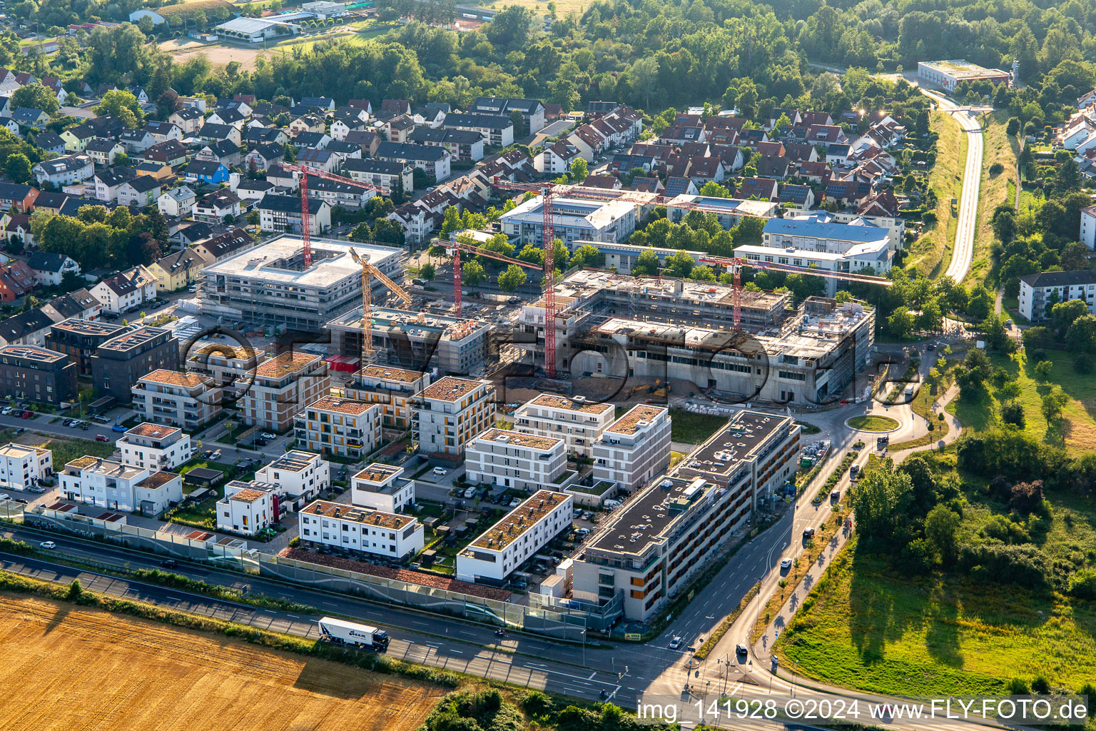 Multi-family house construction site "New City Centre" from the east in the district Mörsch in Rheinstetten in the state Baden-Wuerttemberg, Germany