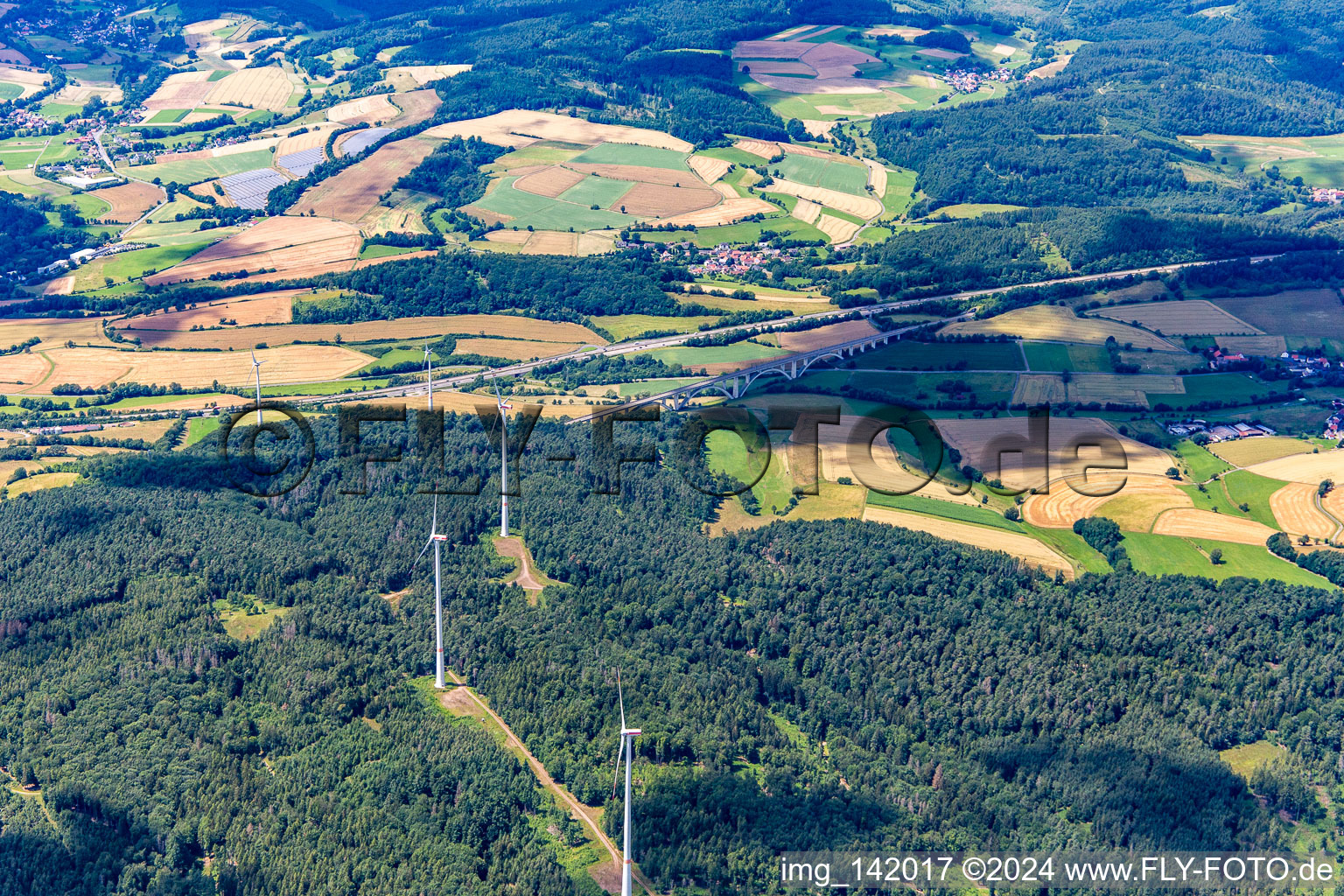 Wind farm in front of the Großschild Bridge in Kirchheim in the state Hesse, Germany