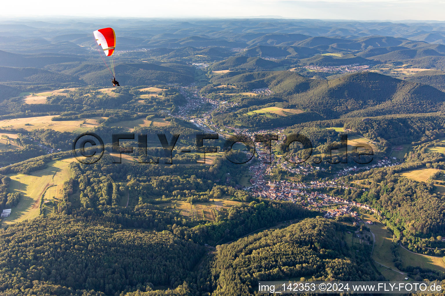 Paraglider over the Wieslautertal in the Palatinate Forest in Rumbach in the state Rhineland-Palatinate, Germany