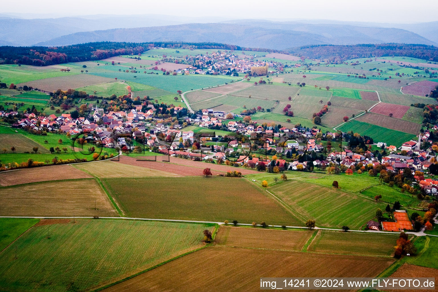 Village - view on the edge of agricultural fields and farmland in the district Haag in Schoenbrunn in the state Baden-Wurttemberg, Germany