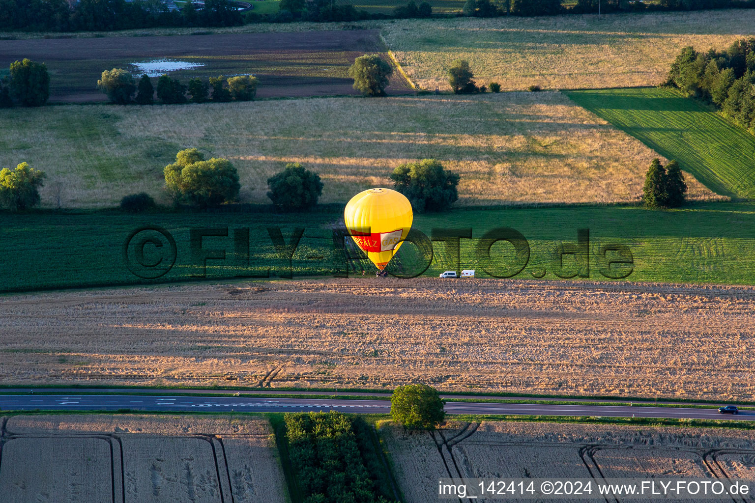 Landing of two hot air balloons "Pfalzgas in Minfeld in the state Rhineland-Palatinate, Germany