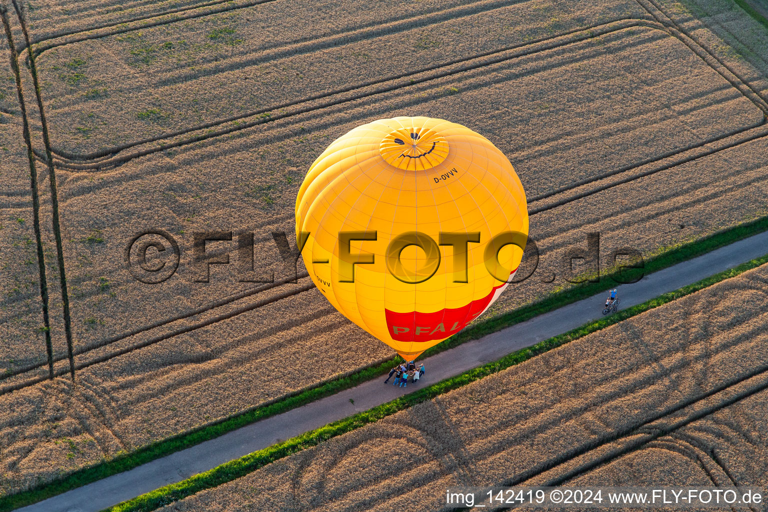 Aerial photograpy of Landing of two hot air balloons "Pfalzgas in Winden in the state Rhineland-Palatinate, Germany