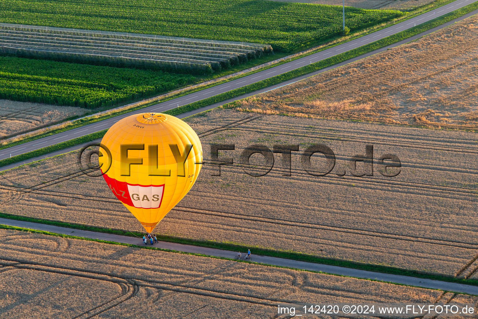 Oblique view of Landing of two hot air balloons "Pfalzgas in Winden in the state Rhineland-Palatinate, Germany