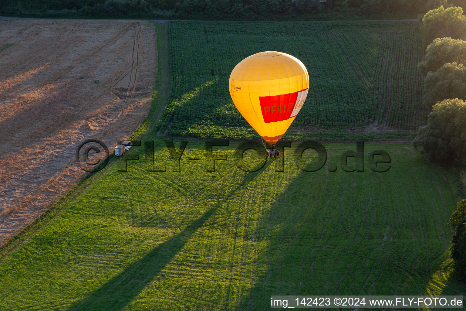 Landing of two hot air balloons "Pfalzgas in Winden in the state Rhineland-Palatinate, Germany out of the air